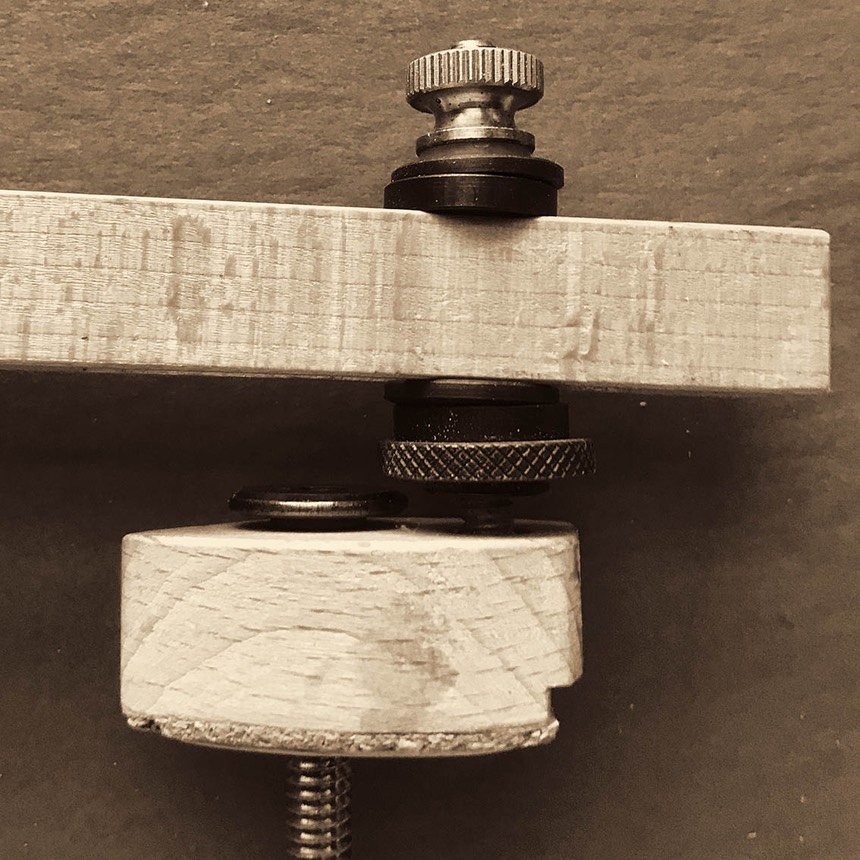 Photo of detail of adjustment knobs for neckset jig