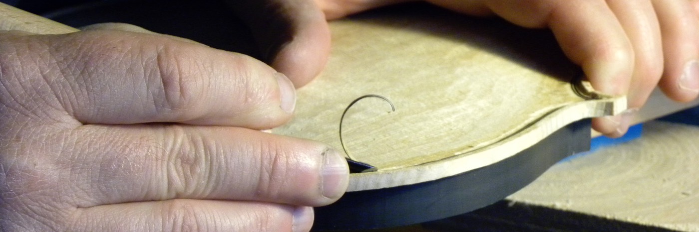 Photo of the carving of a violin channel